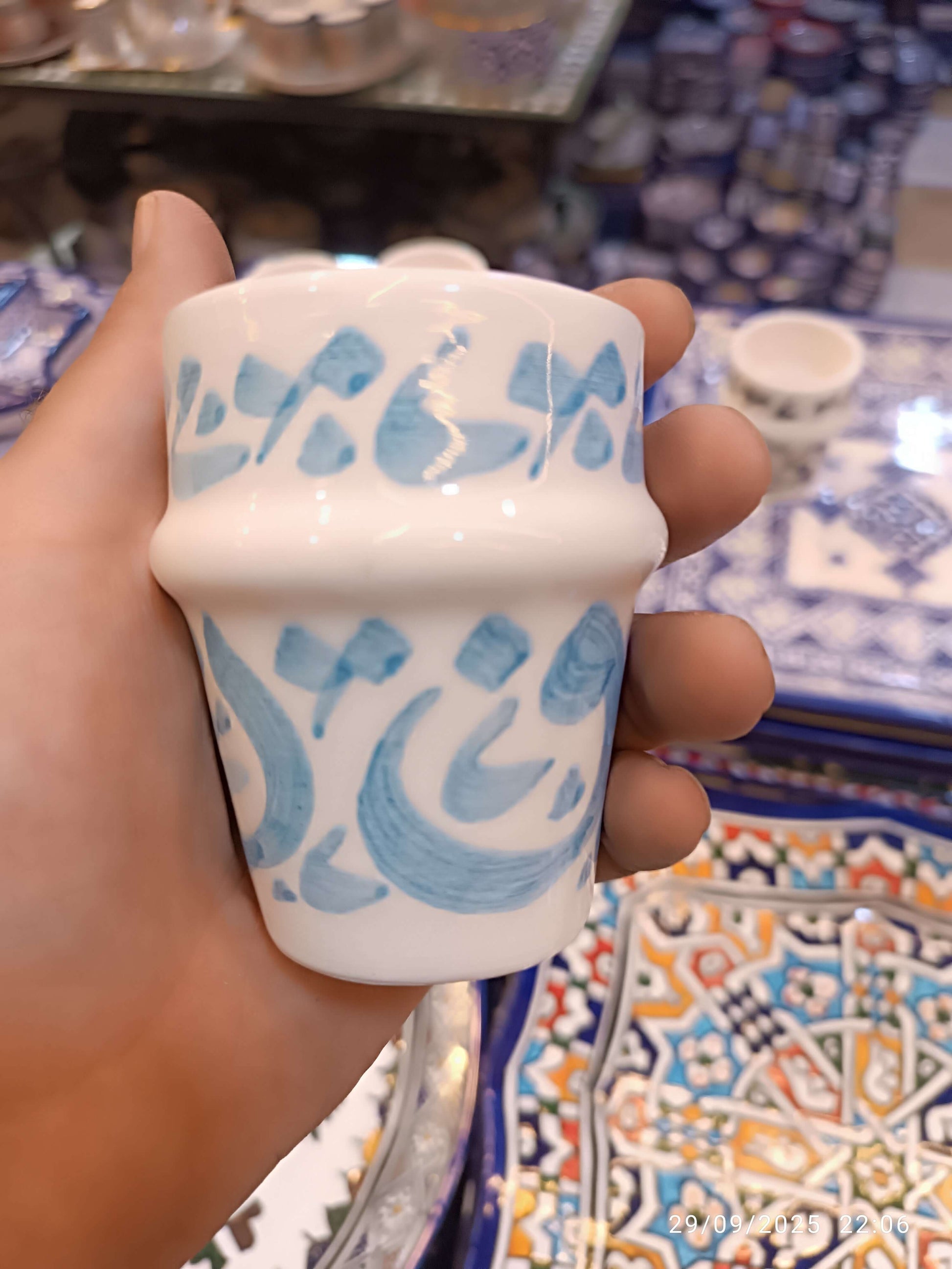 Hand painted dishwasher safe cups featuring Arabic calligraphy design in blue, perfect for coffee or tea.