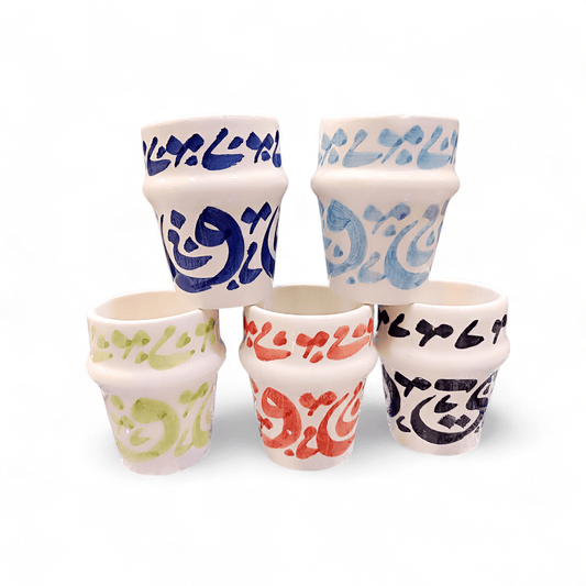 Hand painted dishwasher safe cups featuring vibrant Arabic calligraphy designs in various colors.